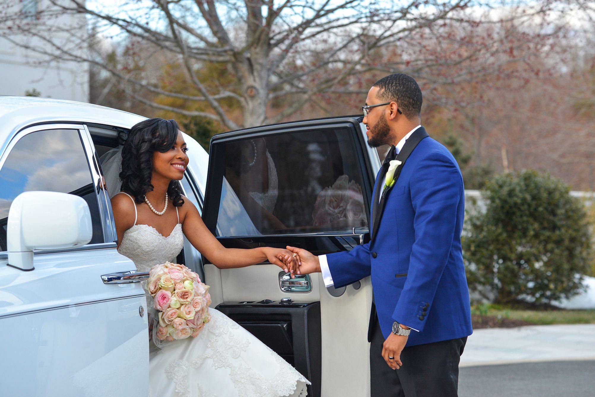 A bride and groom getting ready in a limo.