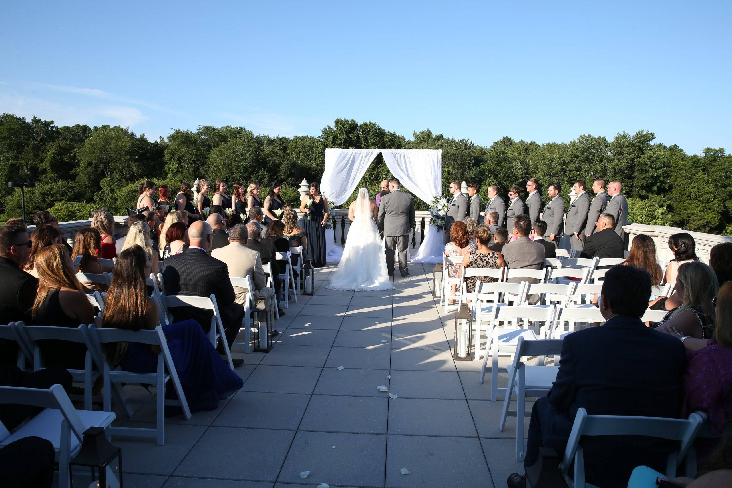 A wedding ceremony on the roof of a building.